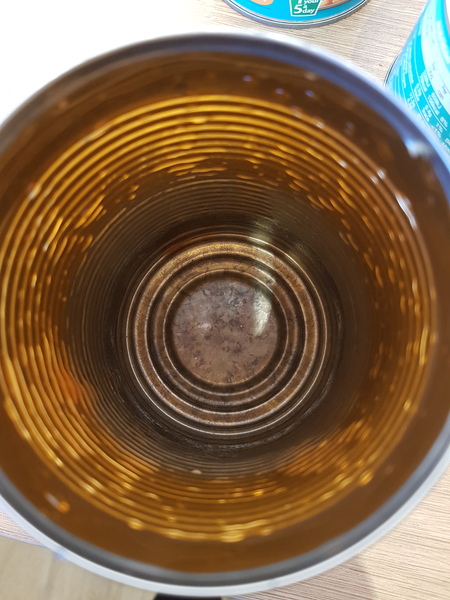 Beans tin black inside, aibu to eat the contents?