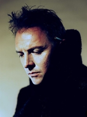 Do you have the photo of Rik Mayall signing something..