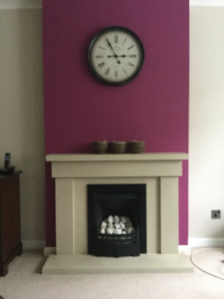 Small living room - dark feature wall. What colours to lighten things up?