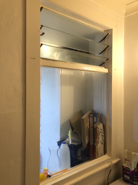 How would you conceal a window left over from an extension?
