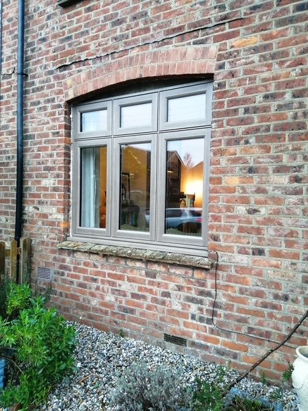 Dark grey windows and stone work on Edwardian and Victorian terraced houses