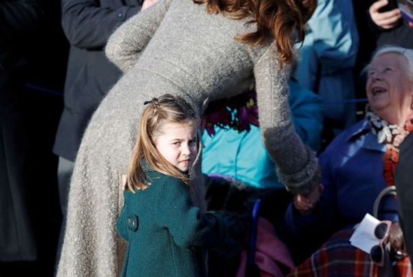 Princess Charlotte 'hugging' lady.