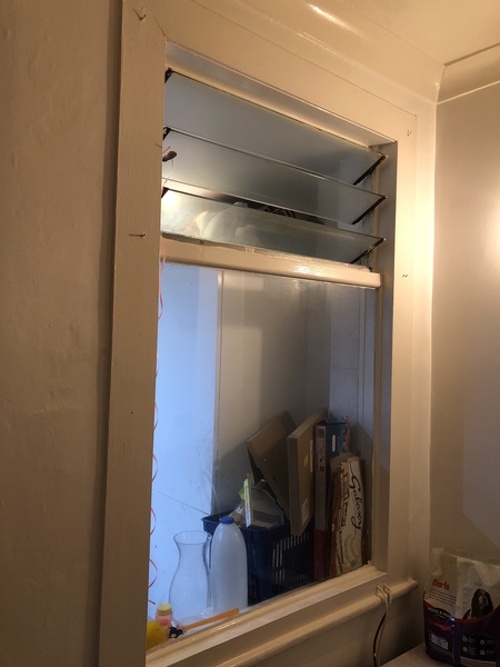 How would you conceal a window left over from an extension?