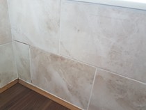 How to crack a bathroom tile to check for leak under bath? (with pics)
