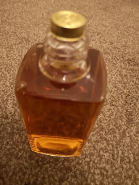 How do you remove the top of a vintage perfume bottle?