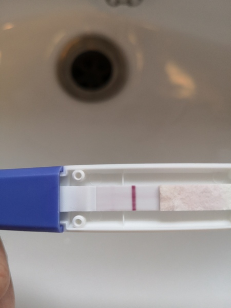 Getting pee pee on test window, faint bfp. Should I believe it?
