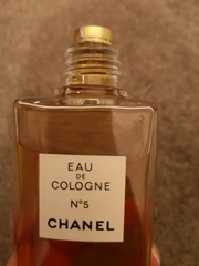How do you remove the top of a vintage perfume bottle?