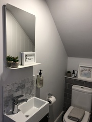 Removing (too small) downstairs loo and replacing it with a coats cupboard?