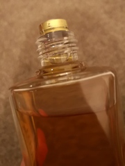 How do you remove the top of a vintage perfume bottle?