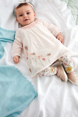 Child in a jumpsuit for wedding
