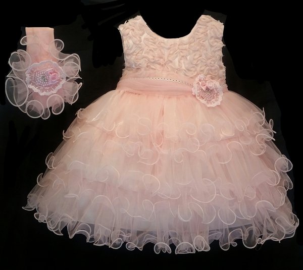 Child in a jumpsuit for wedding