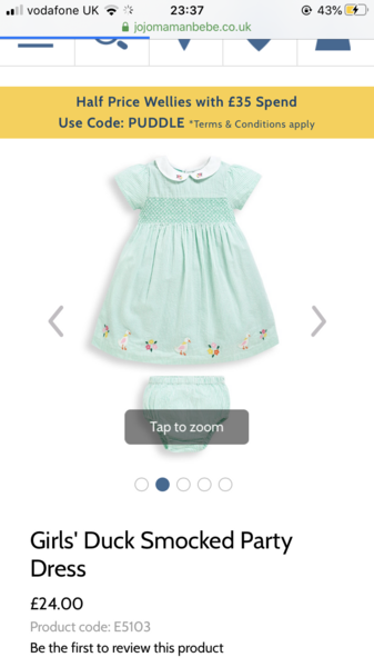Child in a jumpsuit for wedding
