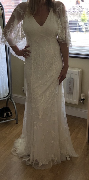 Please help me decide which (budget) wedding dress, photos attached.