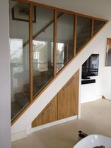 Which tradesman to talk to about a glass internal wall?