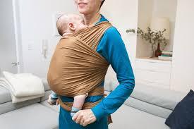 How does a sling help with a baby and toddler?