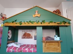 How can I decorate this bed for a boys room?