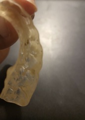 How do I clean my plastic retainer for my teeth?