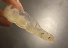 How do I clean my plastic retainer for my teeth?