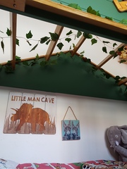 How can I decorate this bed for a boys room?