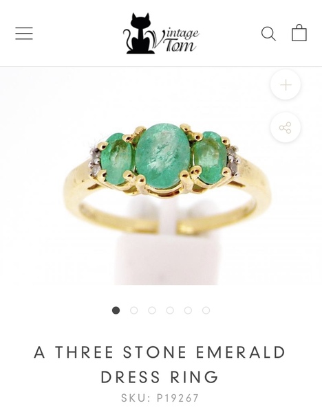A gold ring with emeralds for sub £500