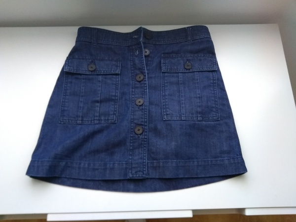 Skirt at gateway of graveyard.