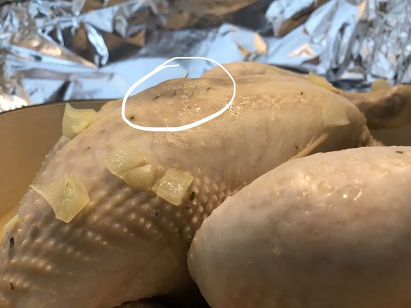 What is this dark red lump on my chicken breast?
