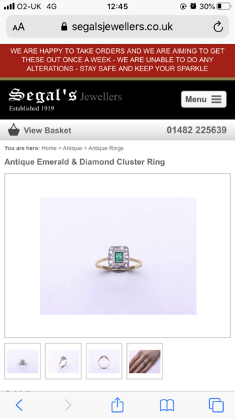 A gold ring with emeralds for sub £500