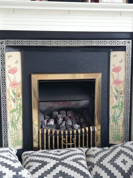 How much would it cost to rip out this fireplace and fill in the wall?