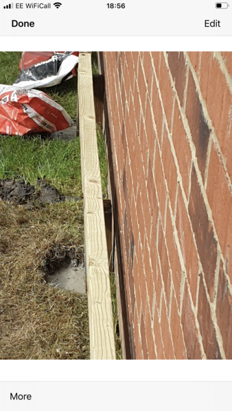 (Picture attached)Fell out with neighbours over a garage wall. Help!!