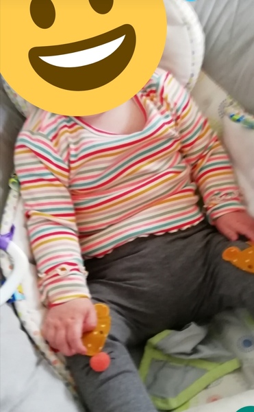 Based on clothes only, is this baby a boy or a girl?