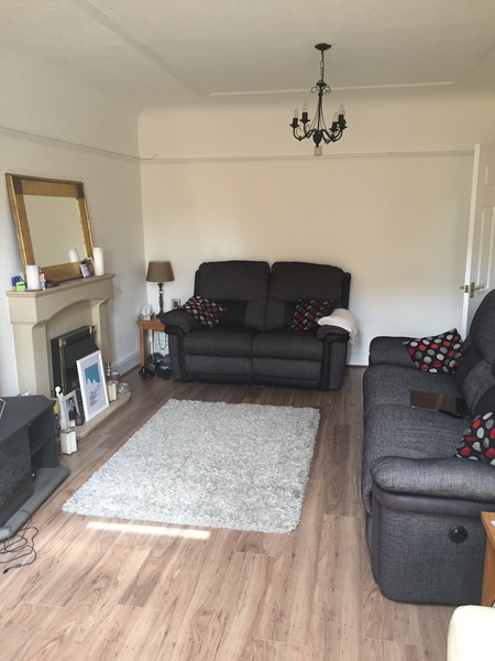 stuck with horrible black sofas and don't know how to redecorate room around it