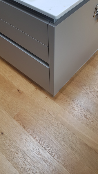 What flooring with grey cabinets in kitchen?