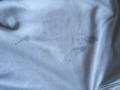 Black oil/grease splashes on washed clothes - any idea what is wrong pls?