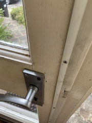 Help. Front door constantly blows open on windy days
