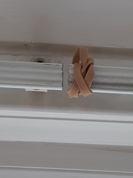 5mm gap between bay window curtain tracks.