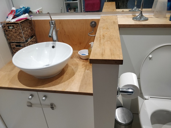 Does anyone know where I can get something to replace this hideous wood sink and toilet cover!