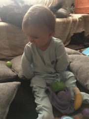 12 month old, twisting arms behind back?