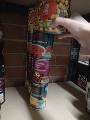 Organising tins/cans on shelving