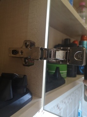 Bathroom cabinet mirror fell off, how do I fix it