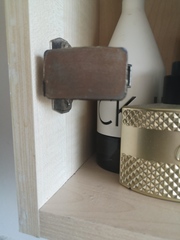 Bathroom cabinet mirror fell off, how do I fix it