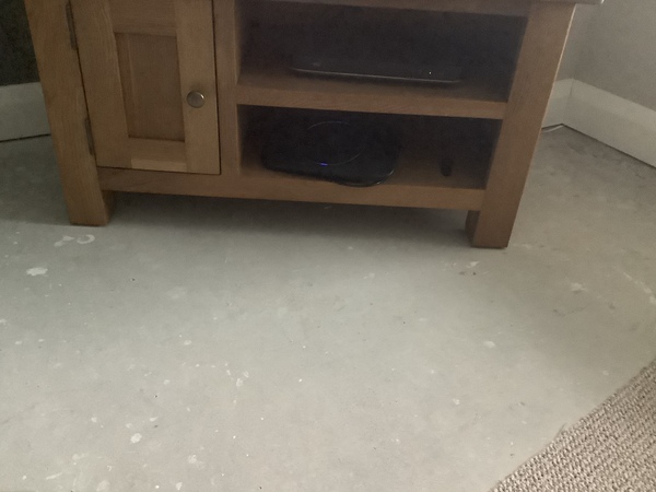 New build left with no floor covering - AIBU