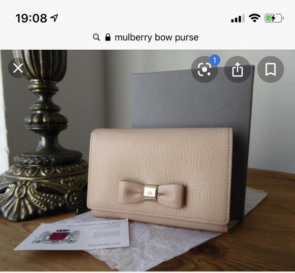 Aibu to expect a refund for (suspected) unauthentic does get purse?