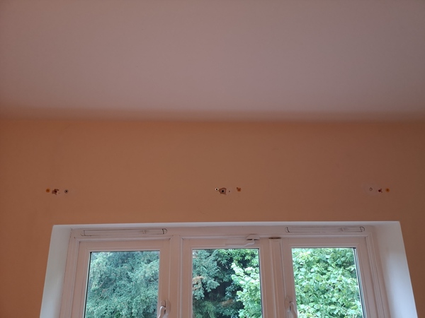 How to fix blind onto wall