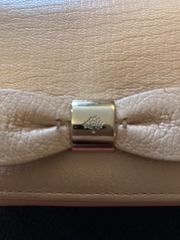 Aibu to expect a refund for (suspected) unauthentic does get purse?