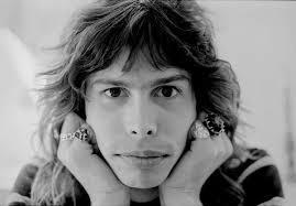 To tell neighbour his son looks like Steve Tyler?
