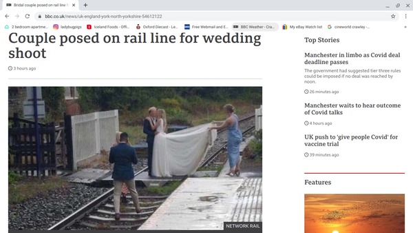 posing for wedding photo on railway lines wtaf ?