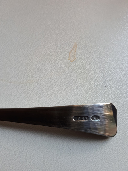 Does anyone know about hallmarks? Is this silver? Or if not what and how to clean?