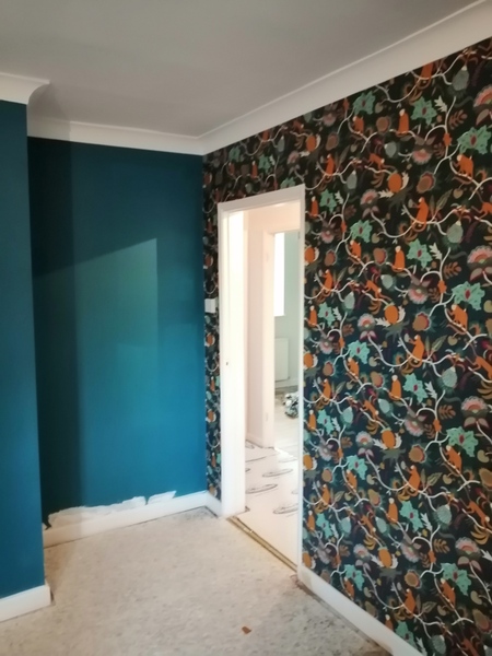 What colour of paint with dark navy wallpaper?