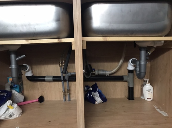 Gurgling noises & bad smell from the kitchen sink when using the dishwasher