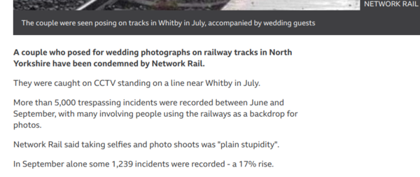 posing for wedding photo on railway lines wtaf ?